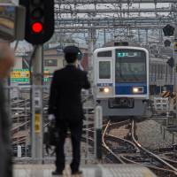 Hot rail: A Seibu Railway Co. train approaches Hanno Station in Saitama Prefecture last month. Cerberus plans 45% Seibu Holdings stake