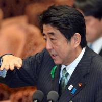A win for the administration: Prime Minister Shinzo Abe speaks Tuesday before the Lower House Budget Committee. The full Lower House passed his budget later in the day. Initial budget passes Lower House