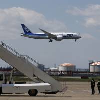 Safety first: A Boeing 787 Dreamliner approaches a runway at Haneda airport at the end of a test flight on Sunday. Dreamliner conducts first Japan flight since grounding over batteries