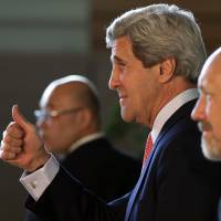 Confident: U.S. Secretary of State John Kerry gestures after meeting Monday with Prime Minister Shinzo Abe in Tokyo. Japan, U.S. differ on North strategies