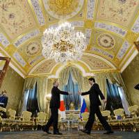 Fresh attempt: Russian President Vladimir Putin and visiting Prime Minister Shinzo Abe start their bilateral summit at the Kremlin on Monday. Abe, Putin agree to revive isle talks
