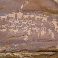 Invisible biological world?: A hunting scene cut into desert varnish by Native Americans in Utah's Nine Mile Canyon. How desert varnish forms has yet to be resolved despite intense research by geologists — a situation that has led some scientists to suspect that it could be the manifestation of an alternative, invisible biological world that they call the shadow biosphere. The shadow biosphere: life on Earth, but not as we know it
