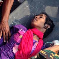 Fighter: Reshma Begum, 18, is carried on a stretcher out of a collapsed building in Savar, on the outskirts of Dhaka, on Friday. Rescuers had located her buried in the rubble of the garment factory complex, where the seamstress had been trapped for 17 days. Rescuers find lucky survivor in collapsed Bangladeshi building
