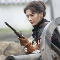 Hot shot: In this year’s taiga drama, actress Haruka Ayase plays the gun-slinging Yae Niijima (left), who reinvented herself as a paragon of modernity after she and her native domain of Aizu suffered a crushing defeat in the Boshin War of 1868-69. NHK spotlights gunslinging daughter of the north in yearlong Sunday drama