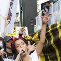 Fight the power: Hip-hop artist Rumi performs during an antinuclear power protest in Tokyo’s Koenji neighborhood on April 10. Rap artist Rumi stokes nuke fires