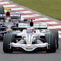 At the apex: A Honda Motor Co. racing car blazes through Fuji Speedway in Shizuoka Prefecture in October 2008 during the Formula One Japanese Grand Prix. Honda looking forward to green return to F1