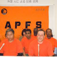 Sit down, stand up: Visa overstayers speak to reporters at a press conference in Shinagawa Ward, Tokyo, on Monday prior to beginning a five-day sit-in to protest plans to deport immigrants lacking legal status en masse. Visa violators stage sit-in to stay
