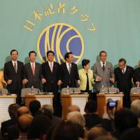 Practice pose: Leaders of 11 parties vying for Lower House seats in the Dec. 16 general election hold hands Friday in Tokyo before a policy discussion. Media grill party chiefs in televised debate