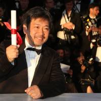 Savoring the moment: Japanese director Hirokazu Koreeda is seen after being awarded the Prix du Jury (Jury’s Prize) for his film “Like Father, Like Son” at the 66th Cannes Film Festival in Cannes, France, on Sunday. Cannes jury prize goes to Koreeda's 'Like Father, Like Son'