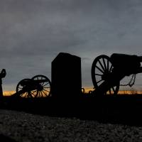 Echoes: Kelli Flory, a teacher from Union, Michigan, takes a photo of the cannons at the Pennsylvania Memorial at Gettysburg National Military Park. The shifting strategy of battlefield preservation
