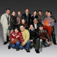 Putting on a smile: A family squeeze together for a portrait snapshot in Liu Qing's sculpture Say Cheese (2008). China's modern art that grieves for the old