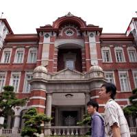 Central: One guidebook walk starts at the restored Tokyo Station. Reflections on two cities