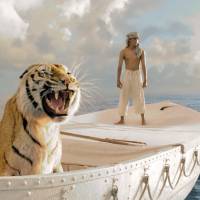 All at sea: Young shipwreck survivor Pi (Suraj Sharma) shares a lifeboat with a Bengal tiger by the name of Richard Parker in “Life of Pi,” director Ang Lee’s adaptation of the best-selling novel by Yann Martel. The film has been nominated for 11 Oscars, including Best Picture, Best Director and Best Visual Effects. 'Life of Pi'