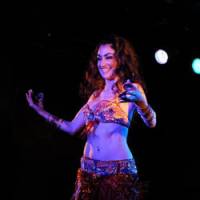 Tania Luiz gives a belly dancing performance in Osaka, and (below) teaches Japanese students during one of her regular classes at a local studio. Fire in the belly, passion in the eyes