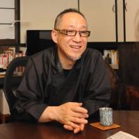 Shoryu Hatoba, one of Japan’s fast-dwindling number
of professional designers and painters of family crests. Family-crest master fears he's one of a dying breed