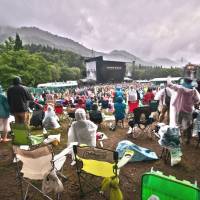 Wish you were here: Last year’s edition of Fuji Rock Festival was unusually dry, but regulars will no doubt plan for the kind of drenching they received in 2011 (left) — even if they don’t let it dampen their spirits. From Björk to Kyary, festival season has arrived