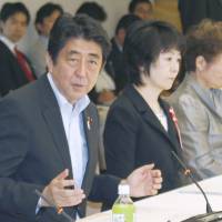 No baby steps: Prime Minister Shinzo Abe speaks to a panel meeting at the Prime Minister's Office on Wednesday. Panel calls for more corporate nurseries