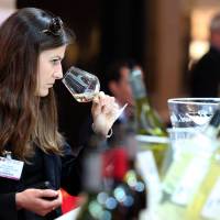 Sniffing out the fakes: A woman tastes wine during the Vinexpo trade fair in Bordeaux, on June 17. Among the issues covered at the world’s biggest wine expo was the issue of wine forgery and how to prevent it. Wine producers go hi-tech to outsmart fraudsters