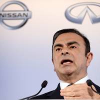 On top: Nissan Chief Executive Officer Carlos Ghosn holds a news conference at the automaker’s headquarters in Yokohama in May. Ghosn earned ¥988 million; no one has gripe