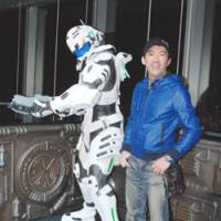 Game master: Shinji stands next to a life-size statue of Sam, the lead character from his new game “Vanquish,” at a press event at Tokyo’s Roppongi Hills. Game director Mikami ups speed, action in 'Vanquish'