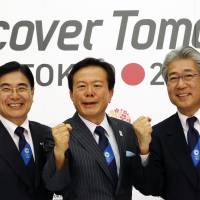 Tokyo 2020 Olympic Bid Committee President Tsunekazu Takeda (right), Tokyo Gov. Naoki Inose and Vice President of Japanese Olympic Committee Masato Mizuno pose during a press conference following the International Olympic Committee’s evaluation report on the 2020 Olympic bids in Tokyo on Tuesday. Tokyo Olympic bid gets high marks