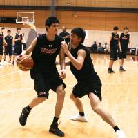 Lofty goals: Forward Yuta Watanabe (left) hones his skills during a recent Japan national team workout in Tokyo. Teen standout Watanabe faces major challenges in pursuit of NBA dream