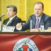 Get it together: International Judo Federation president Marius Vizer (right) and All-Japan Judo Federation president Haruki Uemura answer questions on Monday. Judo chief warns Japan to 'clean up'