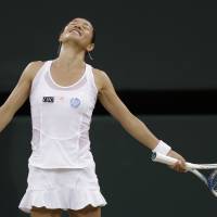 All good things: Kimiko Date-Krumm reacts after losing a point during her third-round match against Serena Williams on Sunday at Wimbledon. Williams won 6-2, 6-0. Date-Krumm, Nishikori fall at Wimbledon