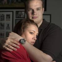Clearing away the clouds: Naomi Haskell helps her son deal with the challenges presented by schizophrenia, her days torn between worry and hope. Here, Haskell hugs Spencer, 19, at her home in suburban Houston. Since he was diagnosed with a type of schizophrenia two years ago, her focus has been on keeping him well. A mother helps son in his struggle with schizophrenia