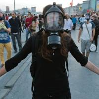 Crushed expectations: Gezi Park protesters hold hands before clashing with police in Istanbul on June 15. Many protests worldwide are now middle-class driven. Global protest grows as citizens lose faith in politics