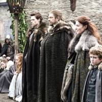 Wolf pack: Ned Stark (Sean Bean, third from right) with his wife Catelyn (Michelle Fairley, beside him) and the rest of the Stark clan in a scene from the first season of the epic fantasy drama Game of Thrones. © 2013 Home Box Office, Inc. Fairley tries to avoid spoilers but it's all part of the game