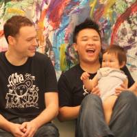 Three men and a baby (L-R): Tokyo Creators’ teachers Skip, Isaac and Masa use music, painting and laughter to help their young students get creative. Bubbles, music and paint as babies learn to create