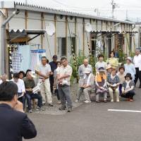 One issue: Evacuees living in temporary housing in the city of Fukushima listen to a stump speech July 4 as the Upper House election officially kicked off. Reactor restarts haunt Fukushima race