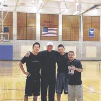 Reunion: Former Tokyo Apache players (left to right) Jumpei Nakama, Minoru Kimura and Cohey Aoki pose with ex-coach Bob Hill at Trinity University in San Antonio. Former Tokyo players train with ex-coach Hill in Texas