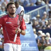 Painful exit: Stan Wawrinka grimaces with back pain in his quarterfinal match against Feliciano Lopez at the Swiss Open on Friday. Lopez led 6-4, 2-6, 4-3 when Wawrinka retired in the final set. Back injury knocks out Wawrinka in quarters