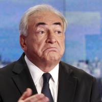 Derailed: Dominique Strauss-Kahn prepares for a TV interview in Paris in September 2011. Strauss-Kahn to face pimping trial in France