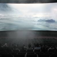 Sky-high thrills: Visitors at Orbi multi-media complex in Yokohama, experience what it’s like to fly around the Earth. Observing the world in Yokohama's giant Orbi
