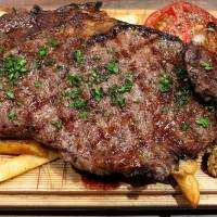 One of many steaks on offer at Butcher Brothers, served on a bed of fries. Light bites of every flavor in Tokyo