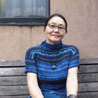 Keen eye: Filmmaker Akiko Kuraoka poses outside a cafe in Shinjuku Ward, Tokyo, during an interview. Akiko Kuraoka's documentaries find fresh relevancy amid Fukushima crisis