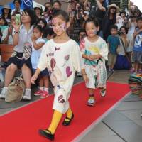 Child’s play: Kids take part in a fashion show during Children’s International Festa 2013 in Shibuya Ward, Tokyo, on Saturday. It's a kid's world at Festa 2013