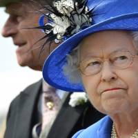 One each way: Queen Elizabeth II and Prince Philip attend the Epsom Derby horse race in Epsom, England, in June 2012. Queen's secret speech for WWIII revealed