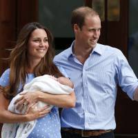 Middle-class heroes: The Duke and Duchess of Cambridge hold their son, Prince George of Cambridge, outside a London hospital on July 23, a day after his birth. The royal couple’s seemingly down-to-earth lifestyle has won them many fans. Are royals living the dream of modern parents?