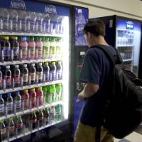 Sugar is sugar: A student in Connecticut buys a soft drink in the school cafeteria. While few parents believe sodas are good for their kids, many of them don’t realize that “healthy” fruit drinks can contain nearly as much sugar as a can of cola. Declaring war on sugar-loaded 'healthy' drinks