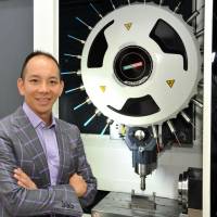 Smooth operator: Xebec Technology Co. President Norihiko Sumiyoshi poses at the company's laboratory in Ota Ward, Tokyo on July 23. Xebec smooths the future edges of deburring tools