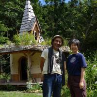 Green thumbs: Kenji (left) and Tomoko Usui in front of their seed bank. Seed bank sprouts support a-plenty