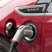 Taking charge: A General Motors Co. Chevrolet Volt is recharged next to the Renaissance Center, GM’s global headquarters in Detroit, on June 6. GM, Nissan log record sales of plug-in vehicles in U.S.
