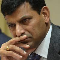 First step: Reserve Bank of India Gov. Raghuram Rajan pauses at a news conference at RBI headquarters in Mumbai on Friday. Rajan's war on inflation puts onus on Singh
