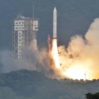 Up and away: The Epsilon, a new solid-fuel rocket, lifts off Saturday afternoon from Uchinoura Space Center in Kagoshima Prefecture as spectators look on. The Japan Aerospace Exploration Agency said the Epsilon released the SPRINT-A, a telescope designed to observe planets, into orbit as planned. New Epsilon rocket chalks up first launch