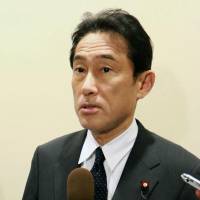 Getting the word out: Foreign Minister Fumio Kishi speaks in front of the press Monday at the United Nations in New York. Japan joins pact to provide women with equal economic, political futures