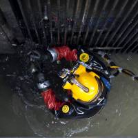 Groping in the dark: Diver Julio Cesar Cu prepares to be lowered into garbage at one of Mexico City’s sewage plants in August. AFP-JIJI Dirtiest job in Mexico: sewer diving